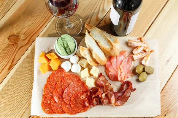Snacks. meat and cheese plate in the restaurant. traditional Italian appetizer - antipasti — Stock Photo, Image