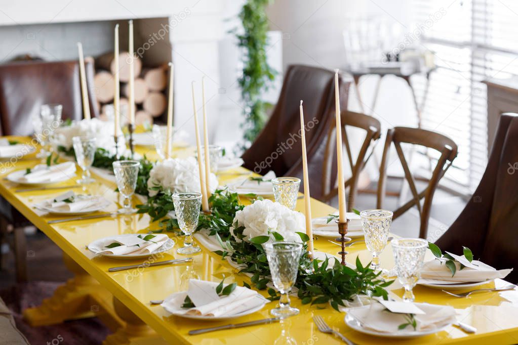 Candles and goblets on a decorated wedding table