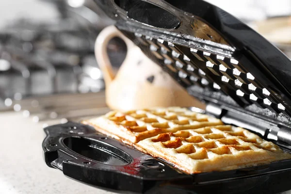 Freshly baked traditional Belgian waffles in iron waffle maker — Stock Photo, Image