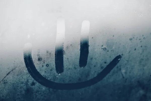 Smile on the misted window — Stock Photo, Image