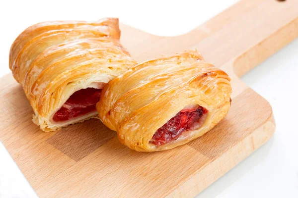 Puff pastry pies with cherry and honey. — Stock Photo, Image