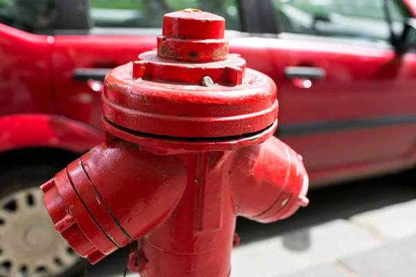 Red fire hydrant water pipe near the road. Fire hydrant for emergency fire access