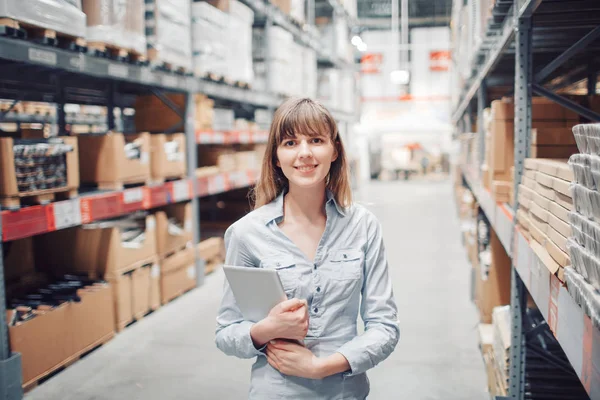 stock taking. beautiful young woman worker of furniture store.