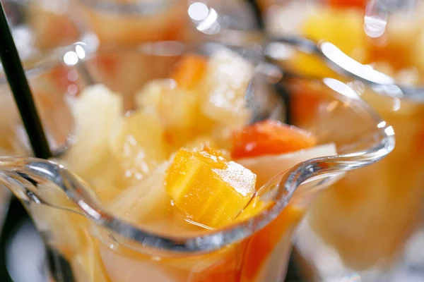 Closeup. Dessert with pieces of fruit. Morning hotel breakfast buffet. Dessert fruit cocktail in cups — Stock Photo, Image