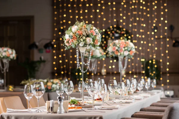 Decorated table in the restaurant, the preparation before the banquet. the work of professional florists.