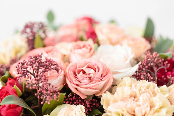 Beautiful luxury bouquet of mixed flowers in red box. the work of the florist at a flower shop. Wallpaper — Stock Photo, Image