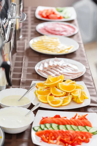 Buffet trays heated ready for service. Breakfast in hotel smorgasbord. Plates with different food — Stock Photo, Image