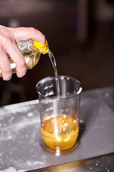 The chef adds olive oil. Beating of homemade mayonnaise with olive oil. Mix ingredients for sauce. The chef uses a blender. Step by step sauce preparation — Stock Photo, Image