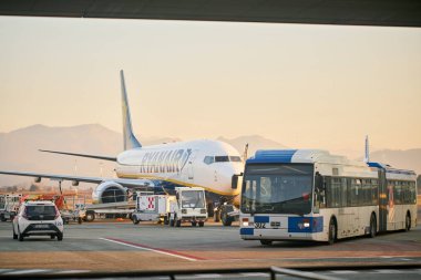 Bergamo, Italy - January 22 2019: Milan Bergamo International airport. Travelers with luggage, ready to board a Ryanair aircraft. Low-cost carrier