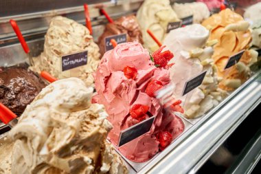 Fruit with strawberries Gelato. Flavors various ice cream in Rome, Italy. Italian gelateria. Assortment of colorful gelato on cafe showcase. Natural fresh ice cream. clipart