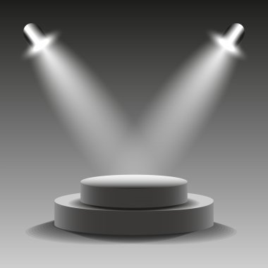 Yuvarlak podyum ışıldak tarafından aydınlatılmış.