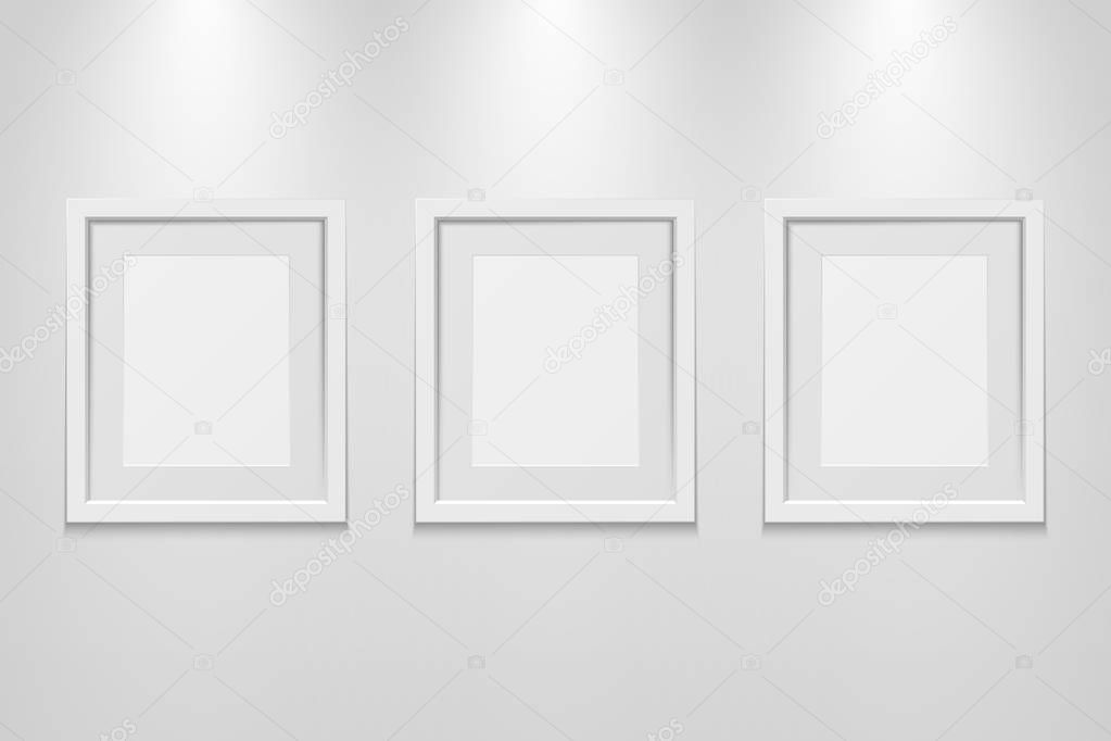Empty picture frames on the wall with light effect