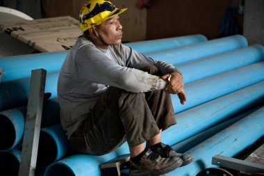 Bangkok, Tayland, öğle yemeği zamanı sırasında işçiler biraz dinlen