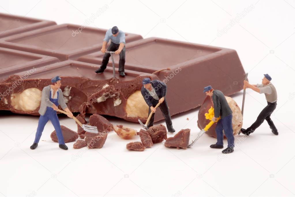 Miniature people: Workers produce chocolate chips