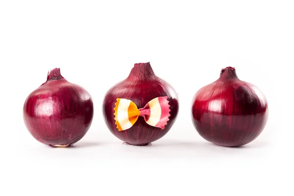 Red onions with a bow tie isolated on white background — Stock Photo, Image