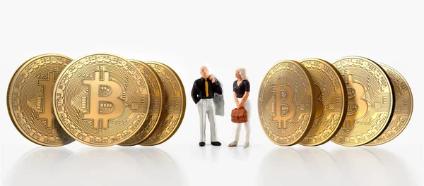 A group of people pose next to bitcoins, isolated on a white background — Stock Photo, Image