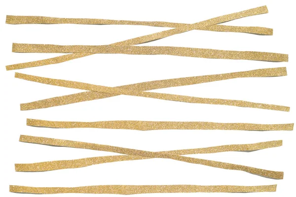 Guld glitter randigt papper klippa på vit bakgrund — Stockfoto