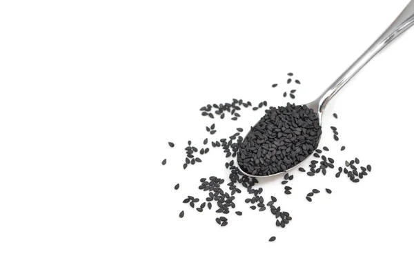 Black sesame in a spoon on white background - isolated — Stock Photo, Image