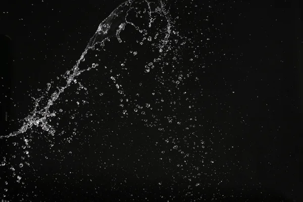 Water splash in de ruimte. Close-up. Zwarte achtergrond — Stockfoto