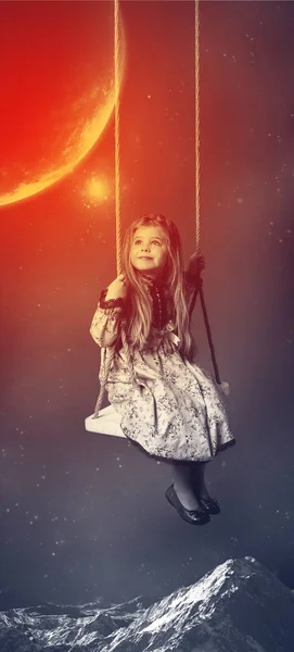 Little girl riding on swing. Space background
