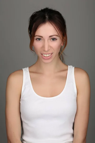 Portrait of displeased girl. Close up. Gray background — Stock Photo, Image