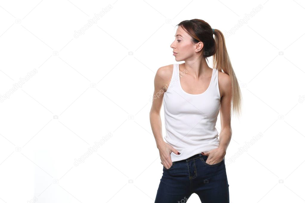 Girl with hands in pockets. Close up. White background