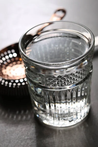 Julep Strainer and vodka on the table. Close up — Stock Photo, Image