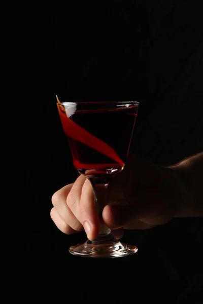 Glass of red moon in the hands. Close up — Stock Photo, Image