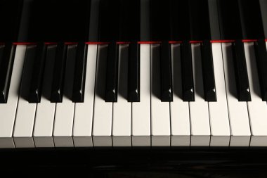 Black piano. Close up clipart