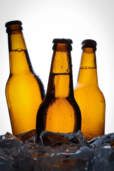 Three bottles of beer. Close up. White background