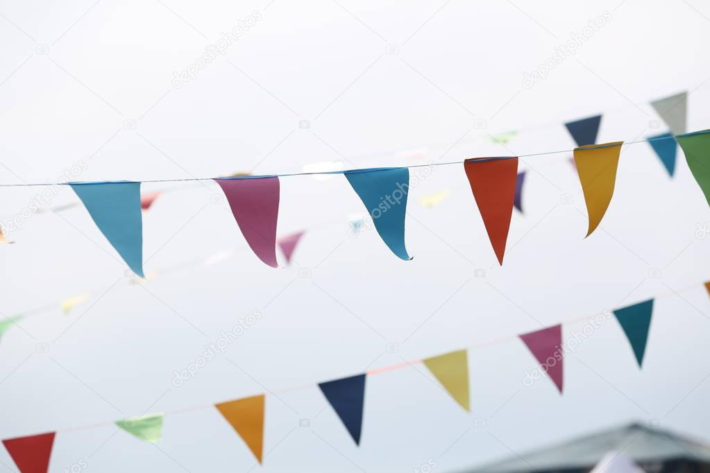 Festive flags on grey background. Close up