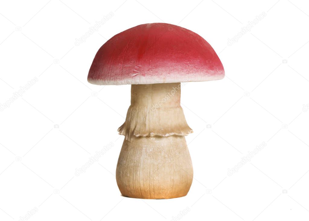 Red mushroom statuette. White background
