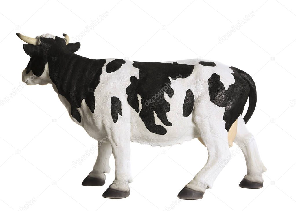 Cow statuette. White background
