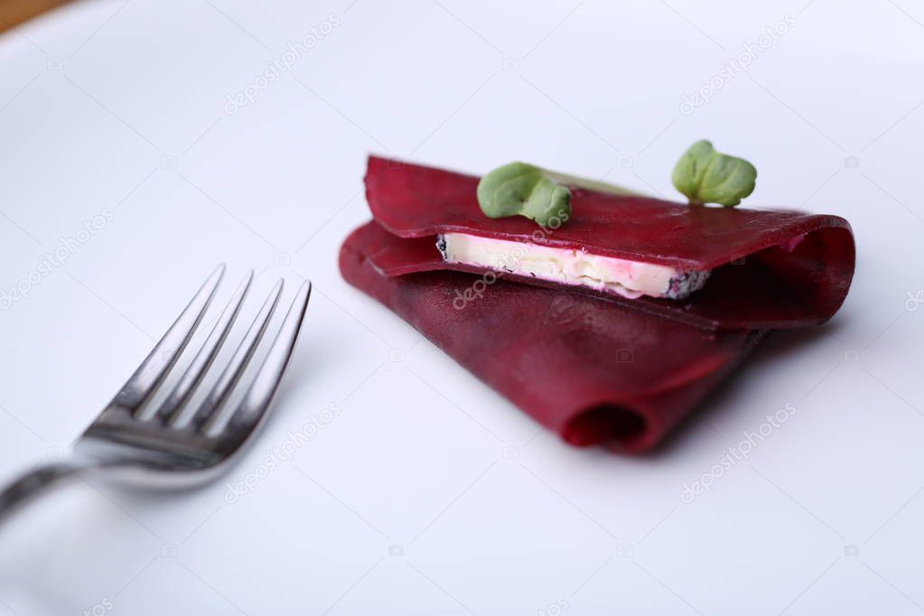 Beetroot and fork on the plate