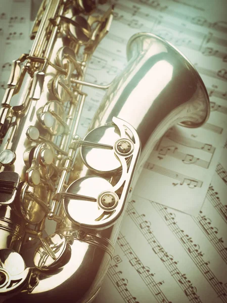 Vintage saxophone with music notes.