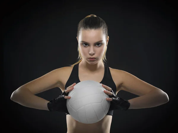 Beautiful young girl athlete in a black top with an aggressive p Royalty Free Stock Photos