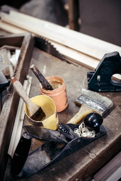 Closeup of carpentry tools in carpentry workshop. Cutter, brush,