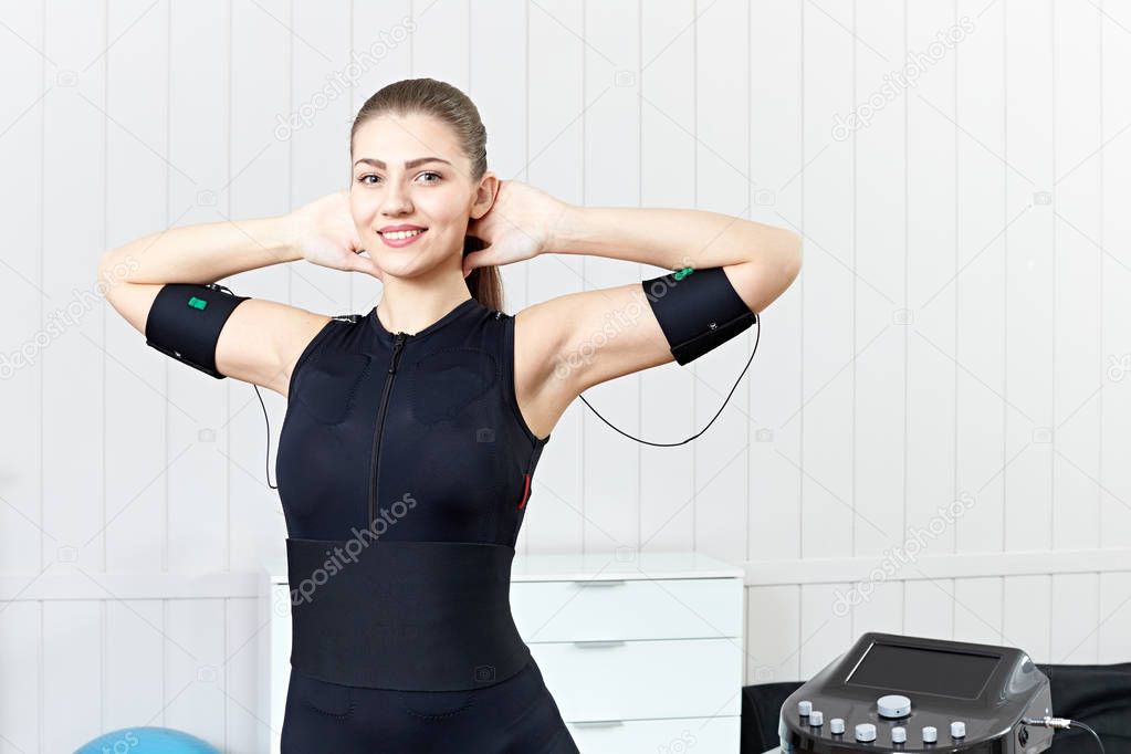 Exercises for women on the electro-muscular machine.