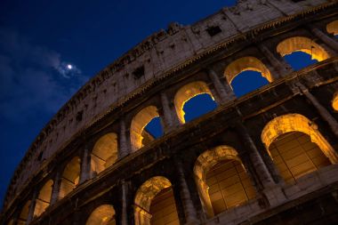 A beautiful night view of the Colosseum clipart
