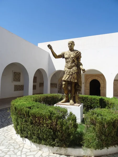 Bronze statue of the roman emperor Trajan at the entrance to the