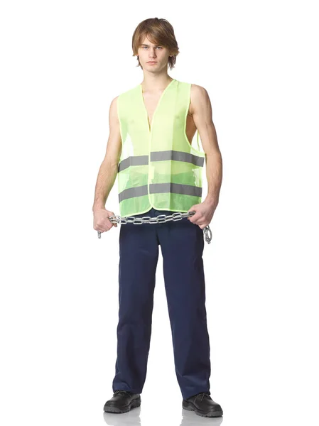 Young repairman in uniform and green transparent waistcoat with — Stock Photo, Image