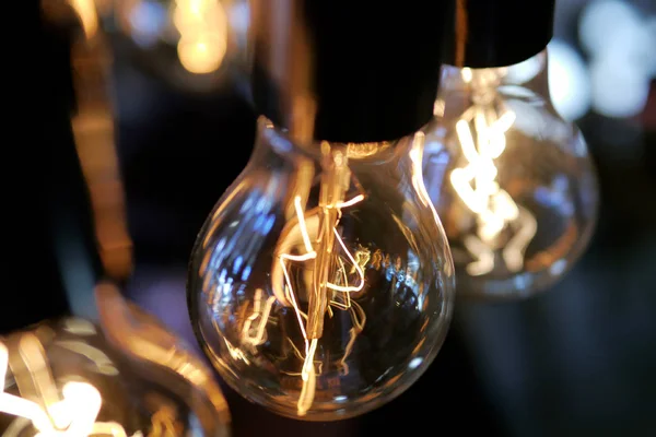 Closeup of luxury round light bulbs in a vintage living room.