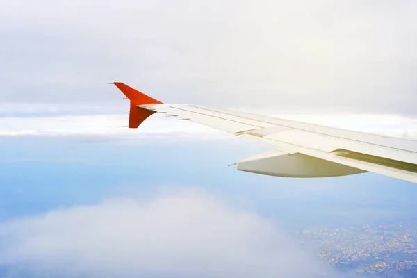 Wing of the plane on sky background