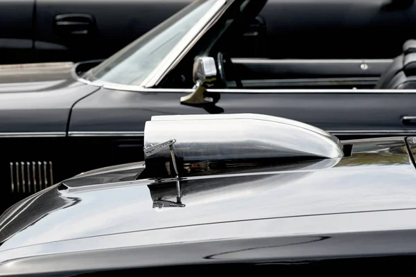 Closeup of a bonnet tuning to increase the power of a chrome tur — Stock Photo, Image