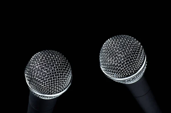 Closeup Two Modern Microphones Silver Mesh Isolated Black Background — Stock Photo, Image