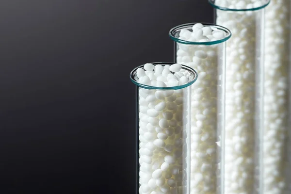 Closeup Granule White Plastic Polymer Laboratory Tubes Dark Background 이미지 — 스톡 사진