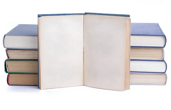 A pile of old books and one opened — Stock Photo, Image