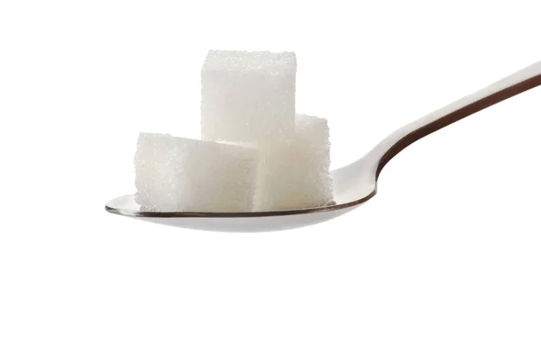Три кубики цукру на ложці — стокове фото