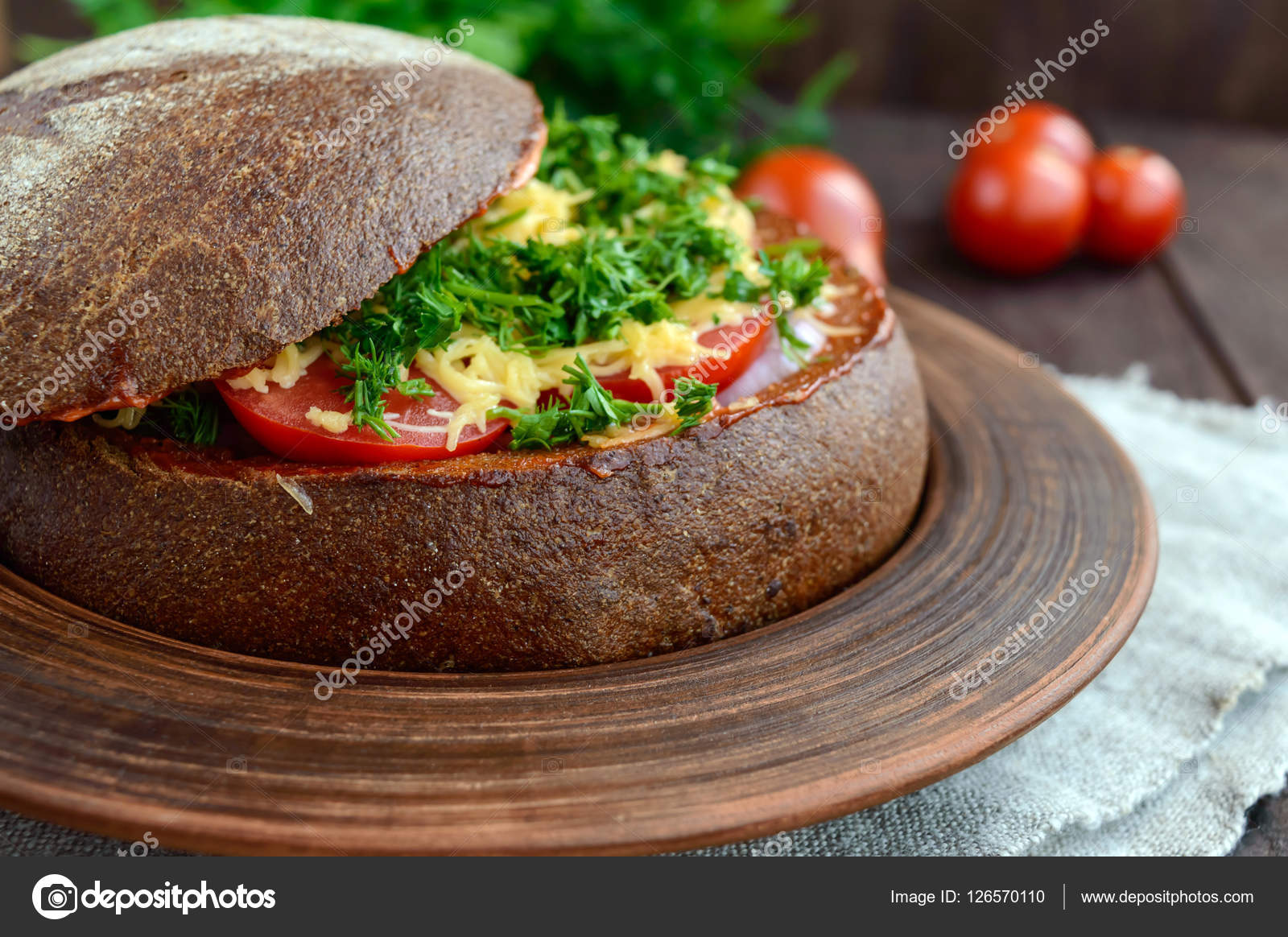 Original appetizer stuffed rye bread, baked. Dish in rustic style