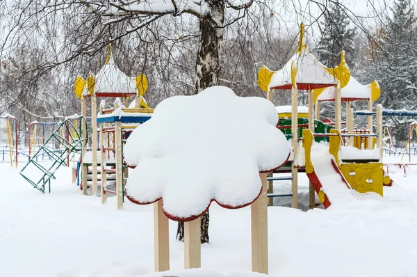 Snowy playground between the trees. Winter landscape. — Stock Photo, Image